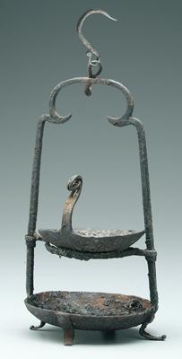 Wrought iron footed grease lamp,