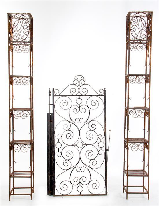 Wrought-iron garden gate and towers