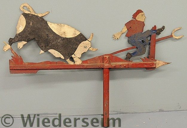 Wrought iron weathervane of a boy
