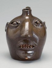 W.T.B. Gordy redware face jug