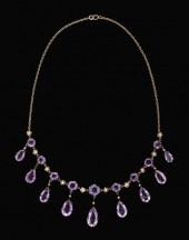 Yellow gold and amethyst styli