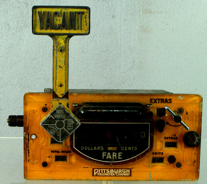 Yellow painted taxi meter by