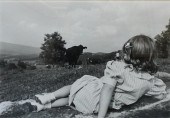 YOUNG GIRL RECLINING IN PASTUR