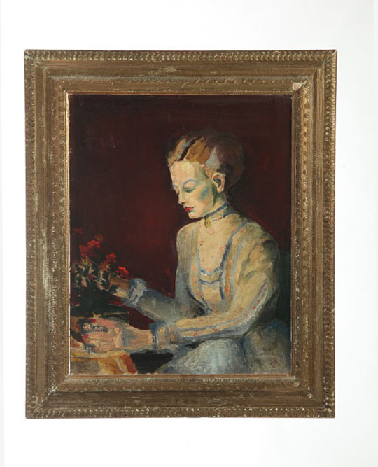 YOUNG WOMAN ARRANGING FLOWERS